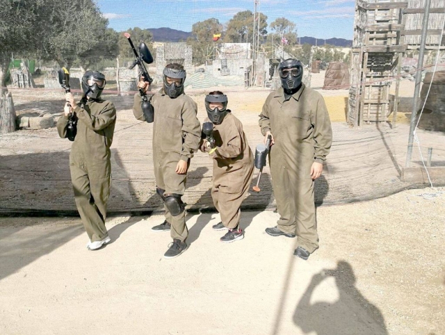  Paintball players with monkeys on the clothes